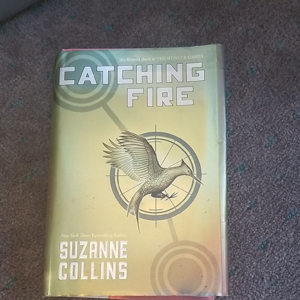 Catching Fire by Suzanne Collins - Gold Coffee Table Book